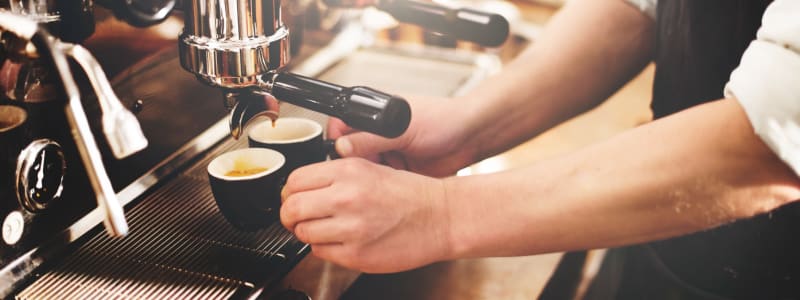 Grabbing a hot cup of espresso at their favorite spot near Eastgold NYC in New York, New York