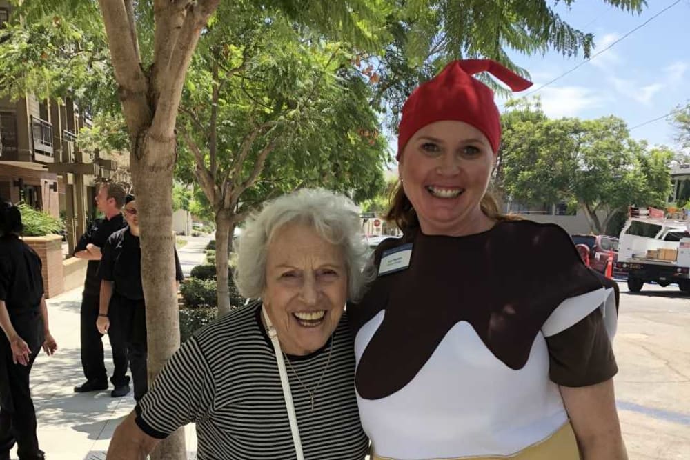 A resident hugging the general manager at Merrill Gardens at Bankers Hill in San Diego, California. 