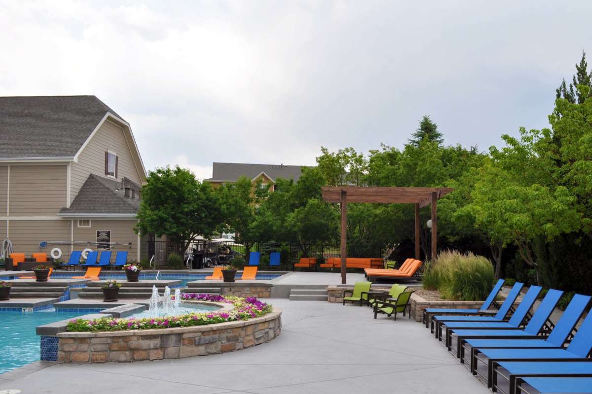 Couch and plants on the pool at The Retreat at Park Meadows in Littleton, Colorado