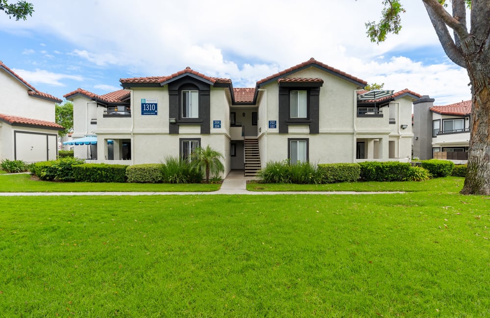 Corona CA Apartments - Brookwood Villas - Apartment Building Exterior with Walkways and Landscaping