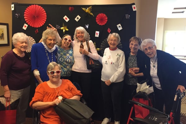 Residents enjoying a party at The Oaks, A Merrill Gardens Community in Gilbert, Arizona.