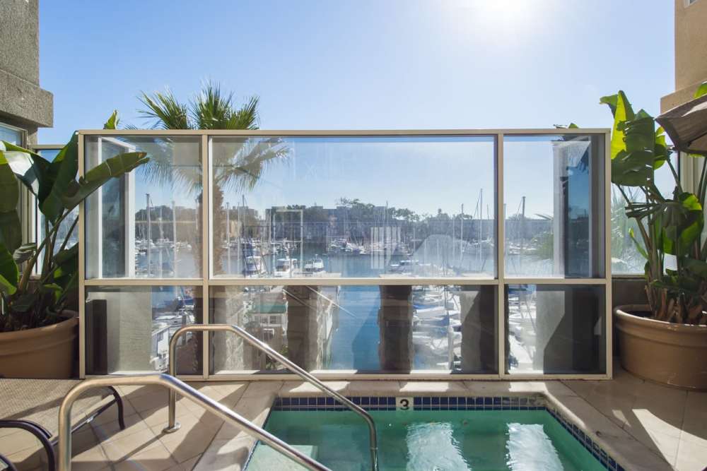Water flows into the pool with luxury at Capri Apartments in Marina Del Rey, California
