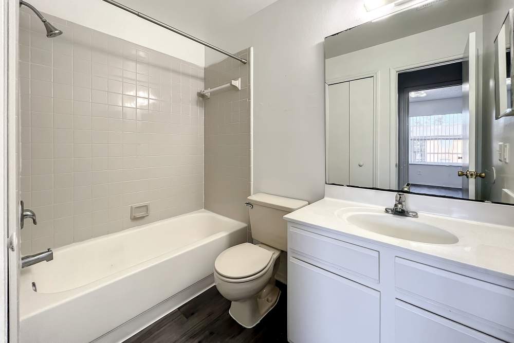 Bathroom with mirror and storage space at Huntington Reserve in Sanford, Florida
