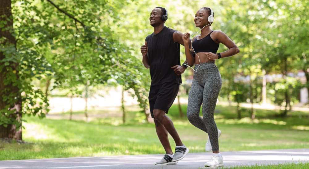 2 people jogging in the park at Bellrock Summer Street in Houston, Texas