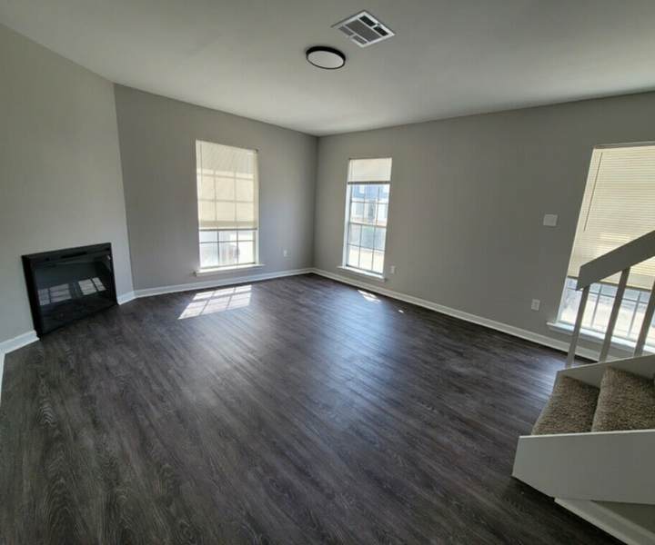 Unfurnished living room with window at Stonebridge Manor Apartments in Gretna, Louisiana