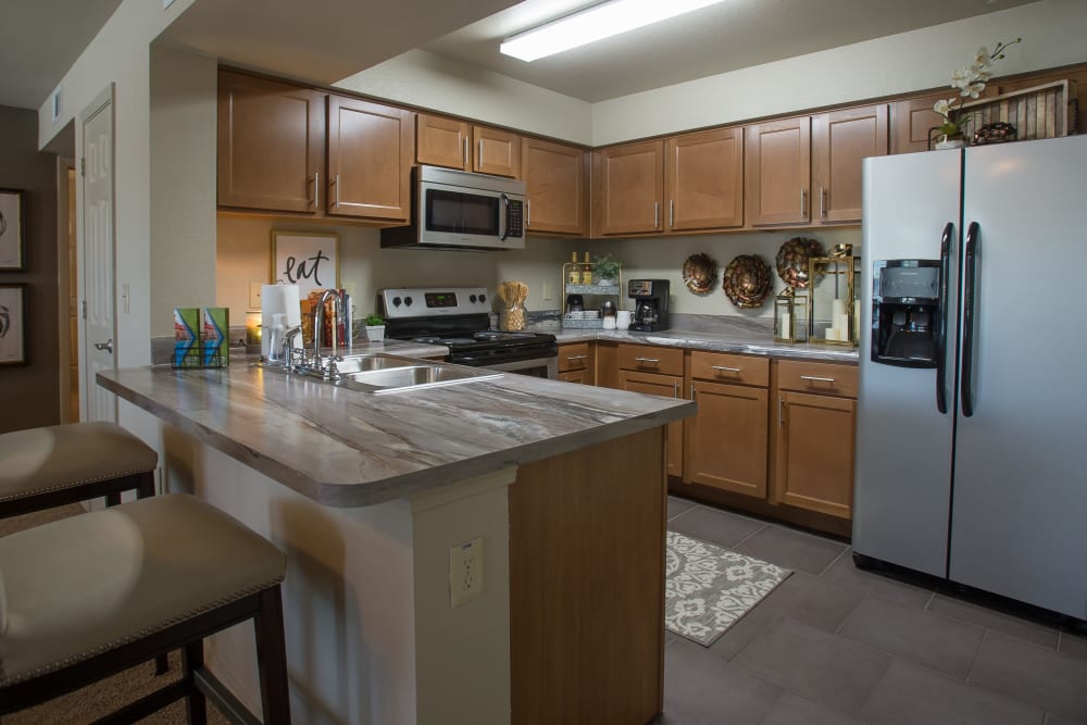 Fully-equipped kitchen with bar at Tuscany Ranch in Waco, Texas