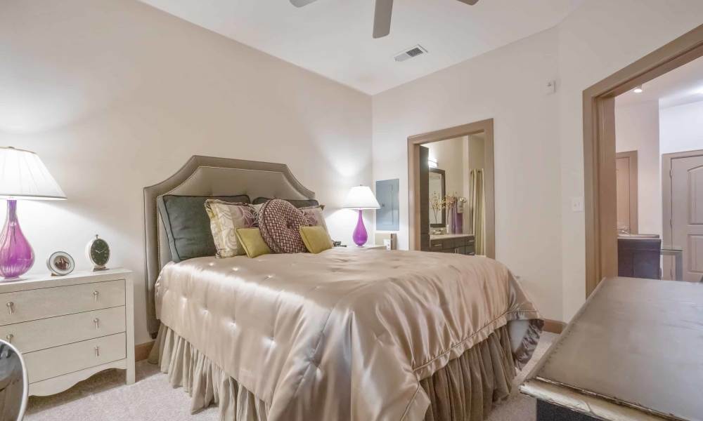 Bedroom with spacious bed at Grapevine Station in Grapevine,Texas