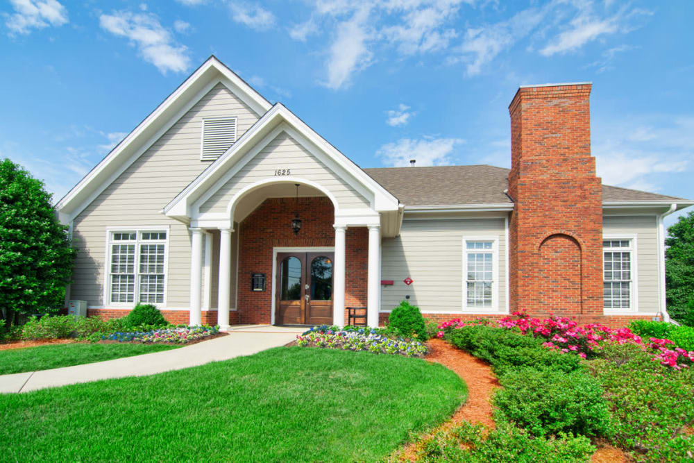 Building exterior with grassy lawn at Bellingham Apartment Homes in Marietta, Georgia