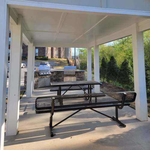 Seating space with barbeque area at Seasons at Poplar Tent in Concord, North Carolina