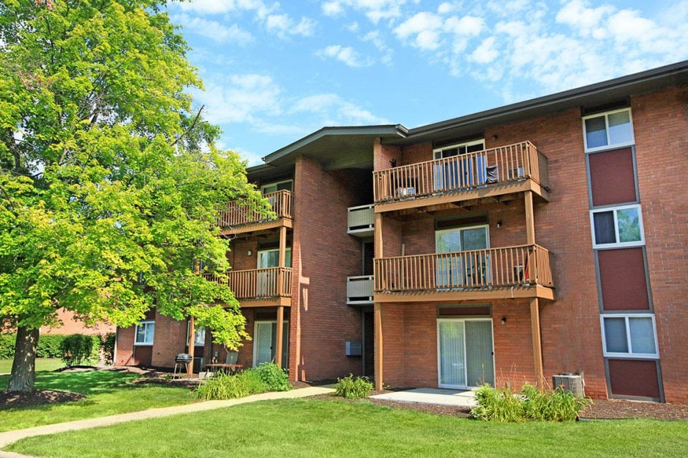 Large tree and lush green landscaping at Brookwood Apartments, Indianapolis, Indiana