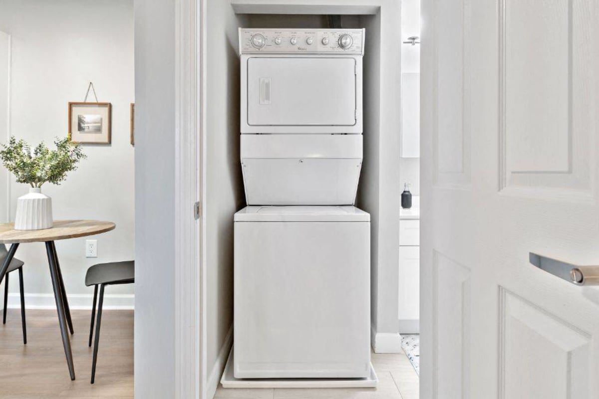 Stacked washer and dryer in an apartment at Addison at Princeton Meadows in Plainsboro Township, New Jersey