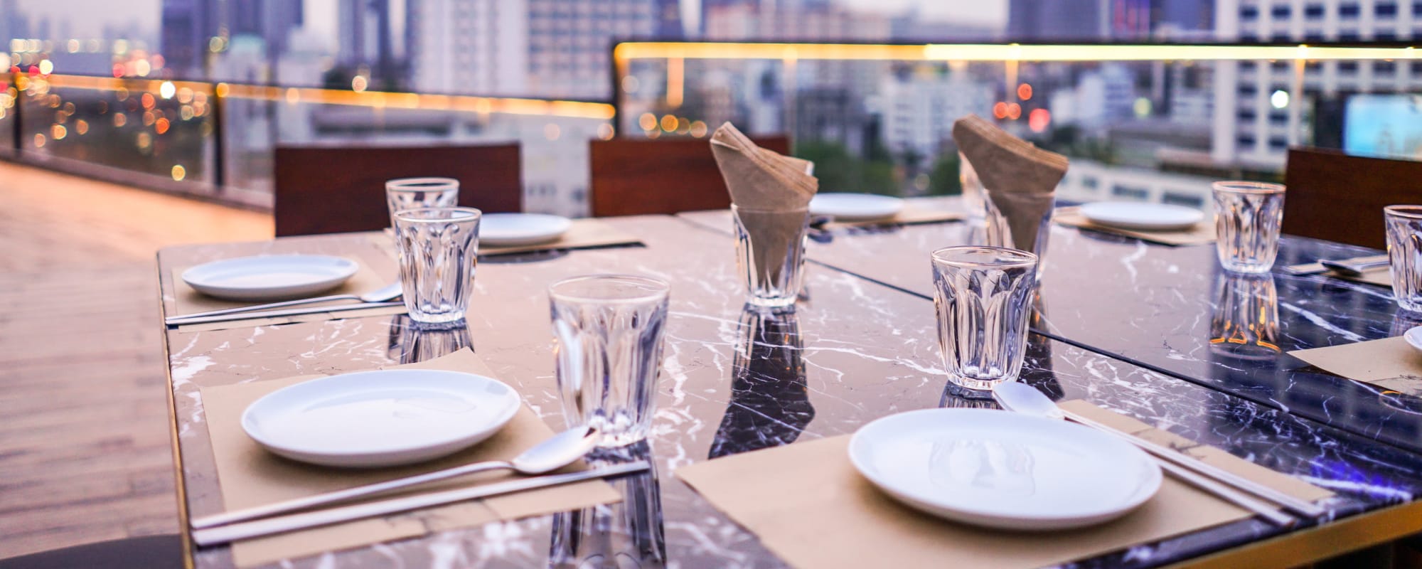 Close-up view of the dining table at the rooftop at Crystal Springs in Fort Worth, Texas