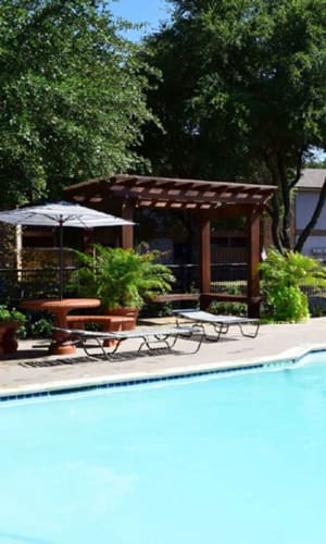 Swimming pool and poolside pergola and picnic area at River Ranch in Sherman, Texas