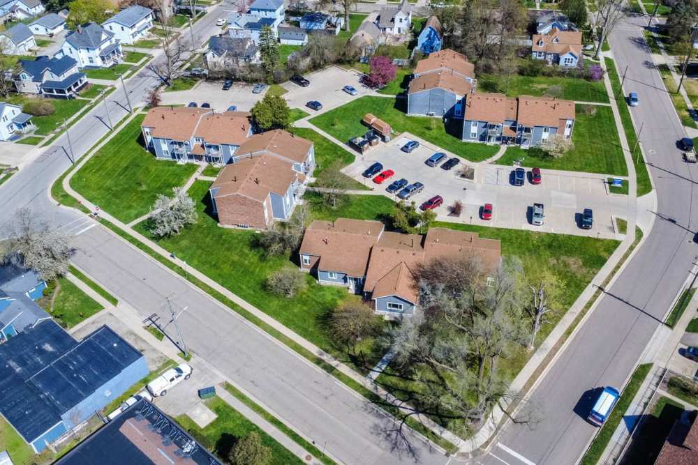 Drone view of buildings and roads at Milan Village in Milan, Michigan