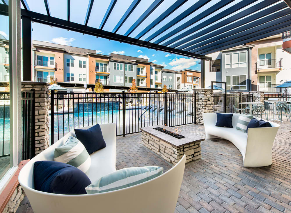 Comfortable seating around a fire in an outdoor community space at Elevate in Englewood, Colorado