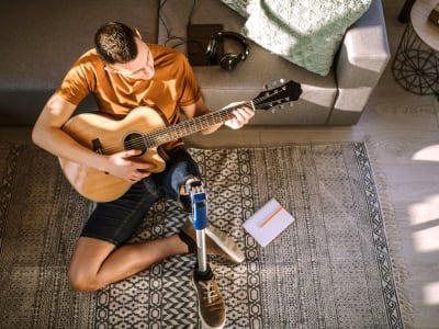 Man playing guitar at Palace Apartments in Concord, California
