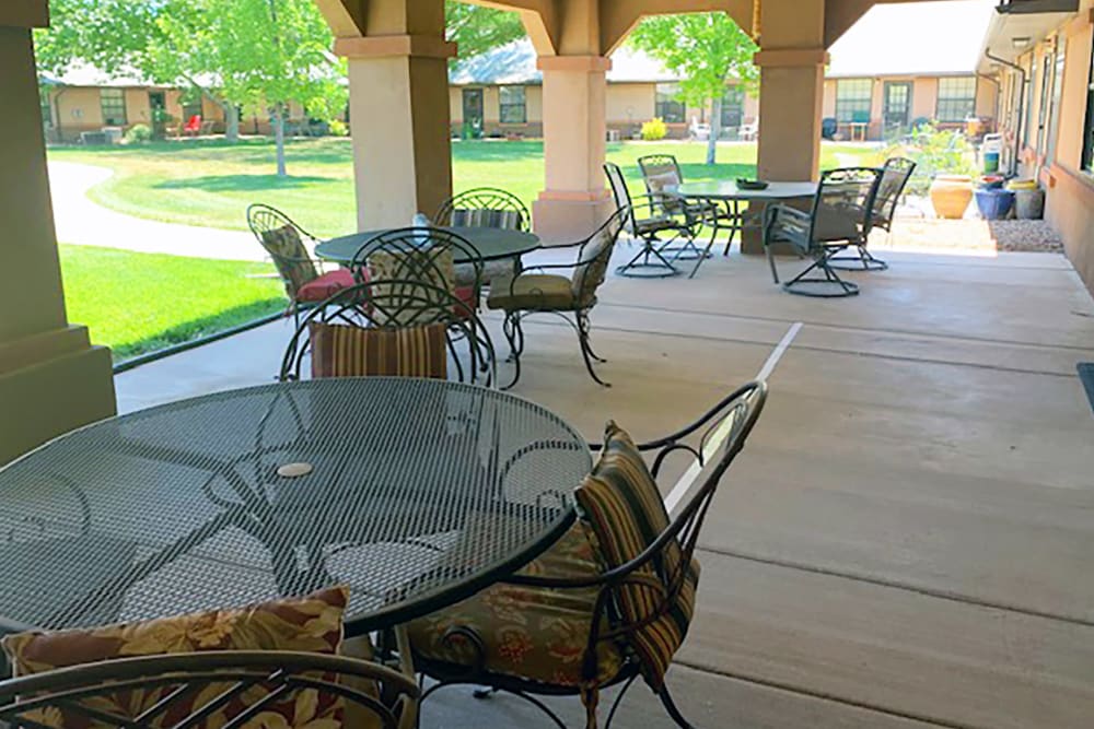 Outdoor breezy patio seating at Peachtree Village Retirement Community in Roswell, New Mexico. 