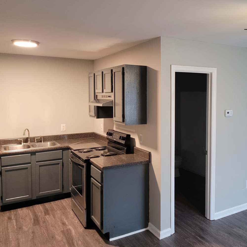 Open layout kitchen and living room at Maple Manor Apartments in Lebanon, Tennessee