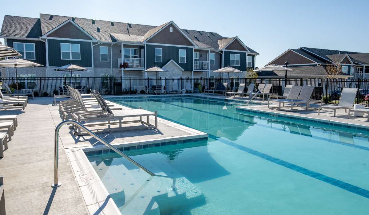 Sparkling pool and loungers at Remington Lake Apartments in Hamilton, Ohio
