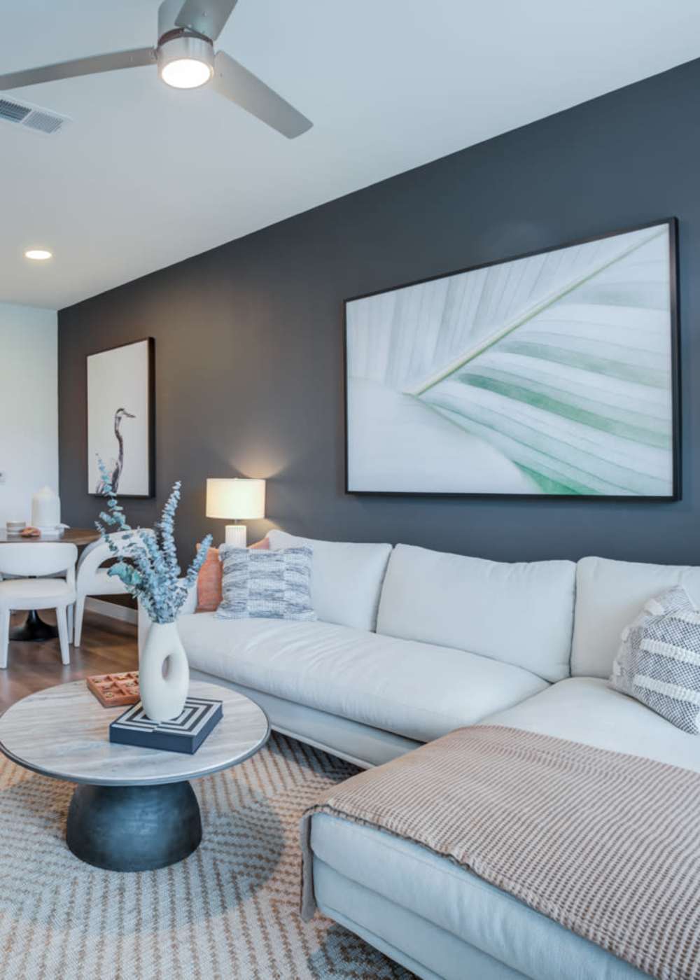 Living room with ceiling fan at Afton Palms in Sanford, Florida
