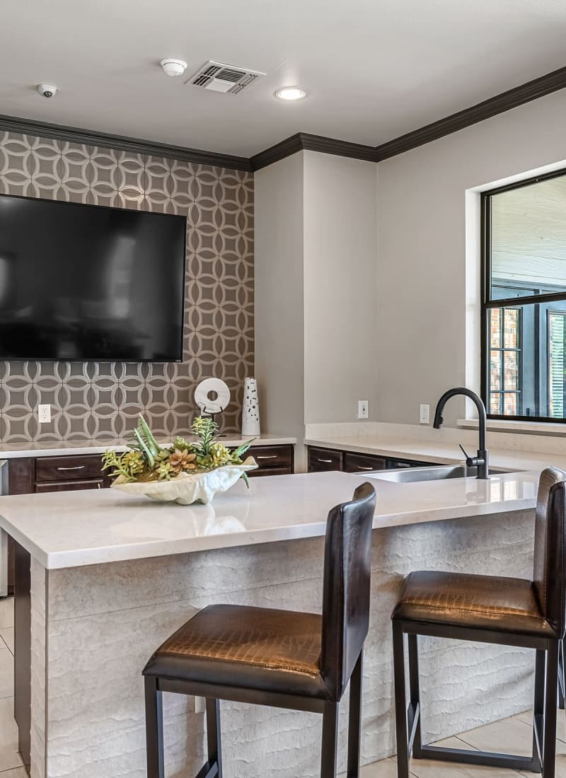 Resident clubhouse kitchen with TV Marquis at Stonebriar in Frisco, Texas