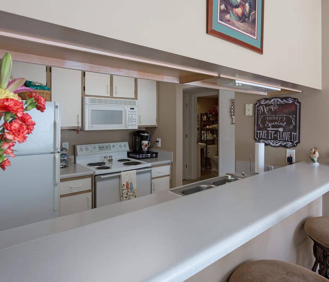 Crescent Oaks offers a beautiful kitchen with breakfast bar in Graham, North Carolina