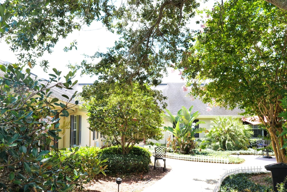 lush landscaped courtyard and walking paths at The Club at Haines City in Haines City, Florida