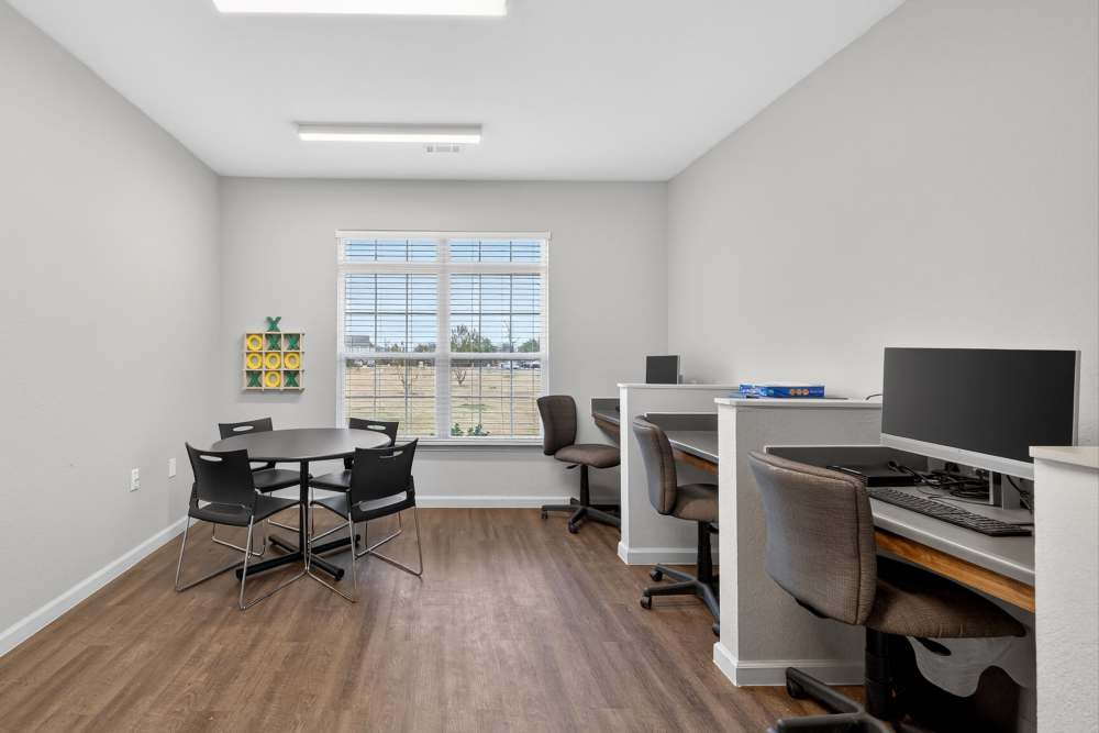 Modern office space with abundant natural light and a stylish workspace at Lakewood Crossing in Granbury, Texas.