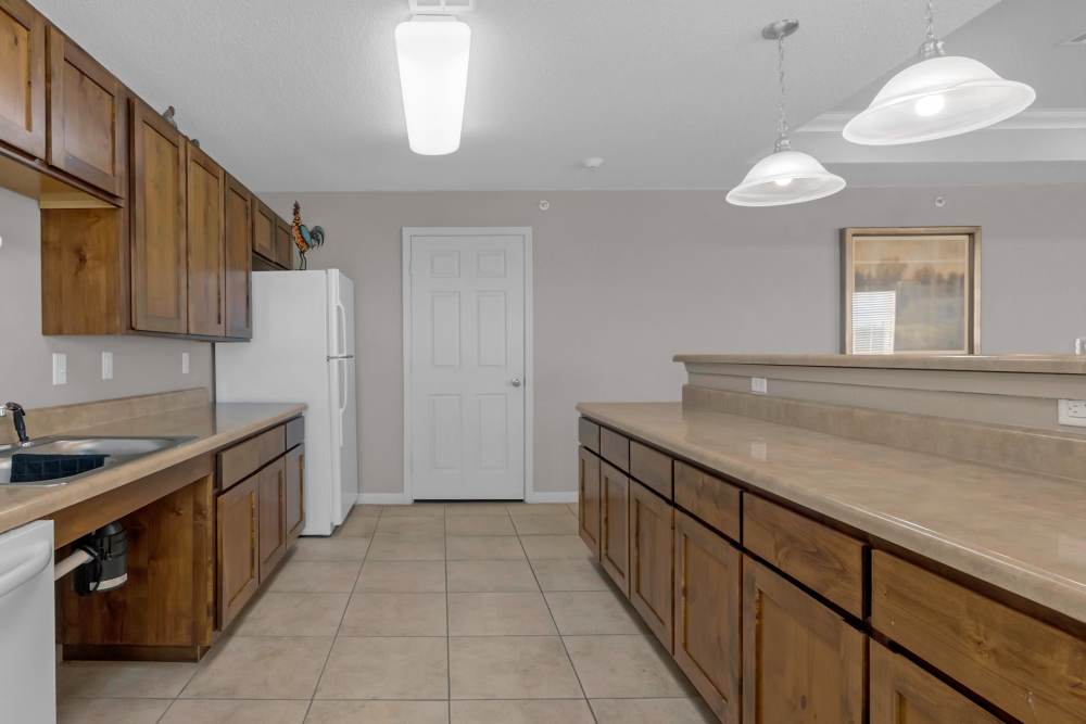Community kitchen with granite counter top at River Ridge in Sand Springs, Oklahoma