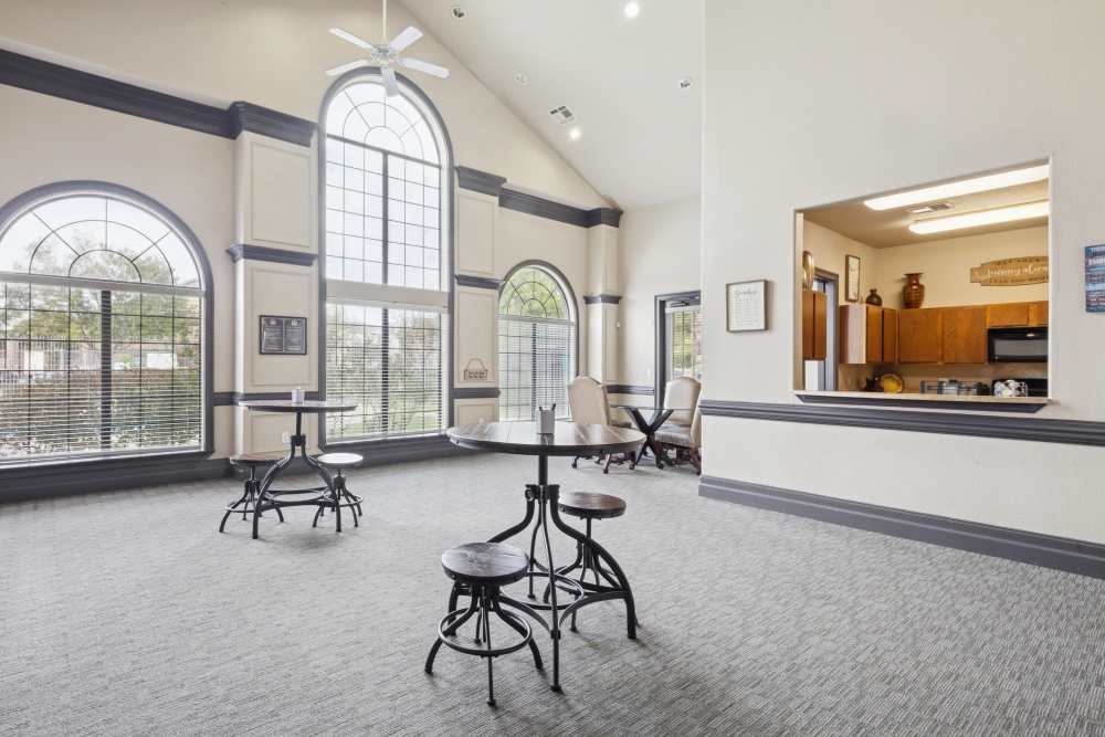 Community kitchen and cozy dining spots beside it at Lansbourough in Houston, Texas