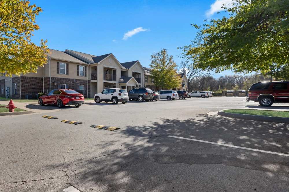 Charming apartment community with lush landscaping at Rolling Meadows Apartments in Glenpool, Oklahoma.