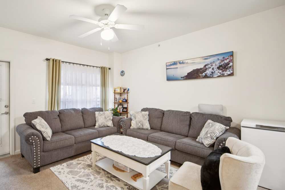 Spacious living room with stylish furniture and natural light at Villas At Meadow Springs in Ankeny, Iowa
