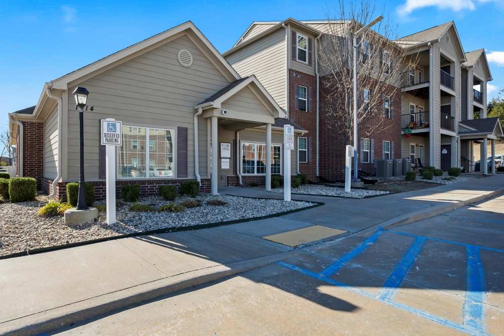 Modern apartment complex with inviting entry and landscaped grounds at Wickham Gardens in Sapulpa, Oklahoma