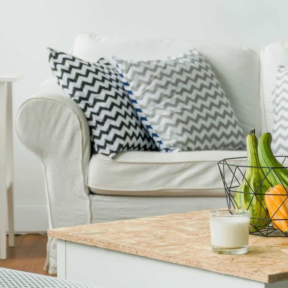 Cozy couch in the apartment living area at Clark Terrace in Baldwin Park, California