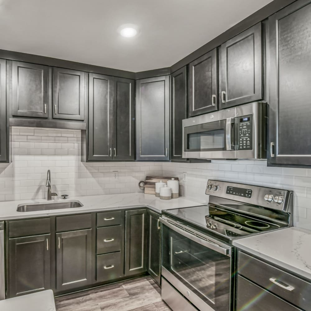 Kitchen with stainless-steel appliances at The Regency, McKees Rocks, Pennsylvania