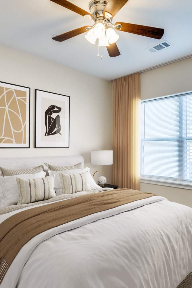 Bedroom with ceiling fan at The Trail Lakes in Fort Worth, Texas