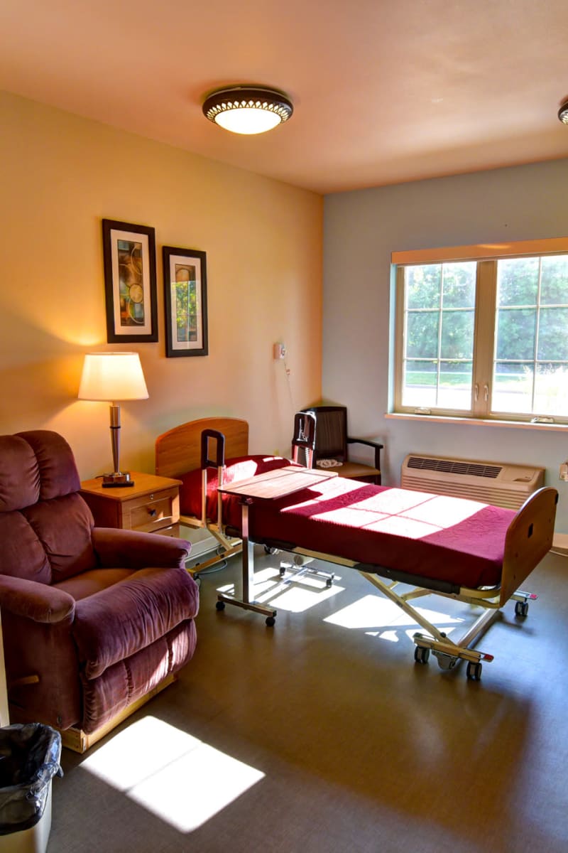 Single-resident room with a bright window at Holton Manor in Elkhorn, Wisconsin