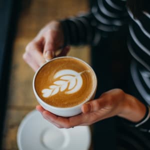 Fancy cup of coffee at The Village at West Long Branch Apartments in West Long Branch, New Jersey