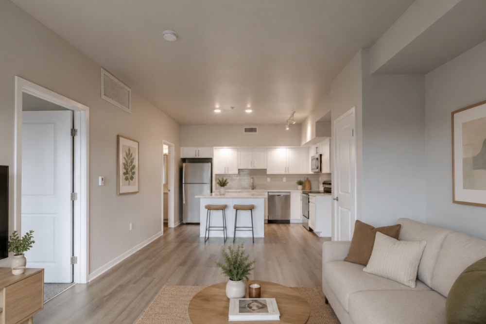 Apartment kitchen with kitchen island at The Greens at Van de Water in Loveland, Colorado  