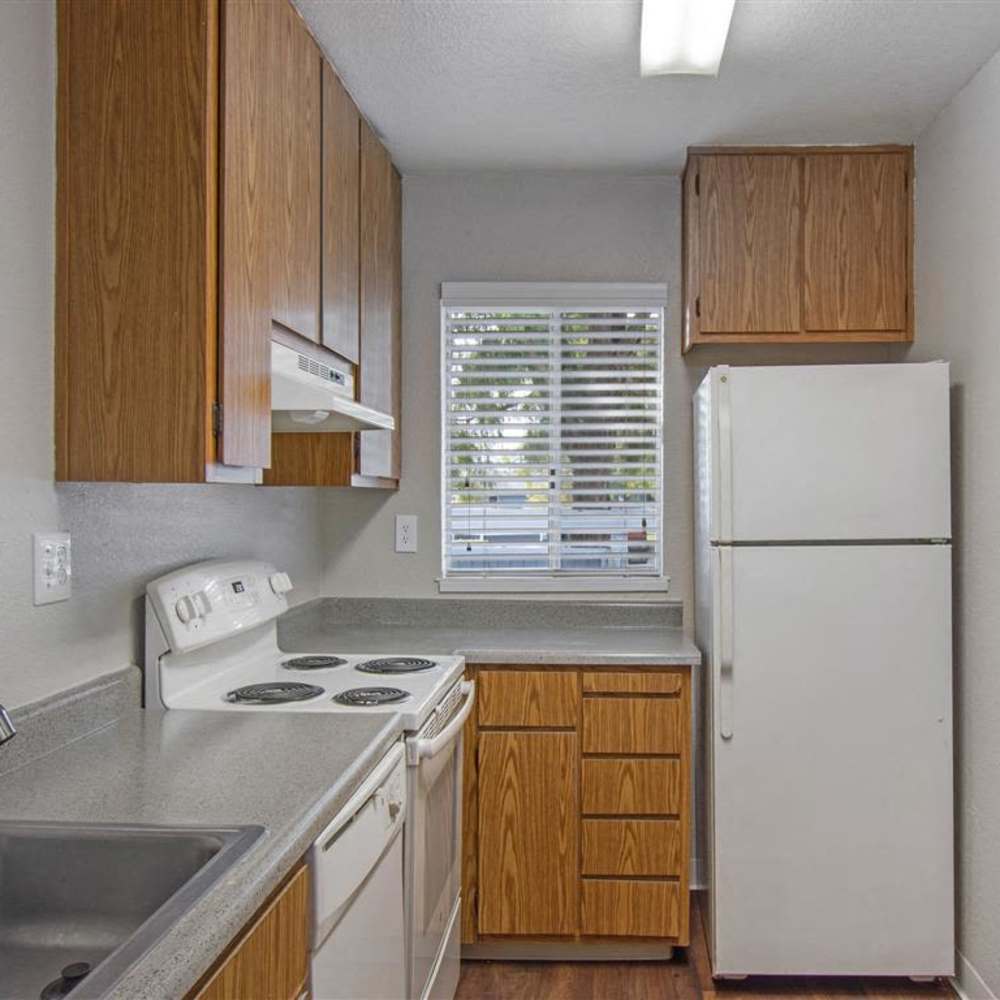 Kitchen with range and refrigerator at Bay Village in Vallejo, California