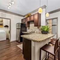 Open Kitchen with cabinet at Avenues at Tuscan Lakes in League City, Texas
