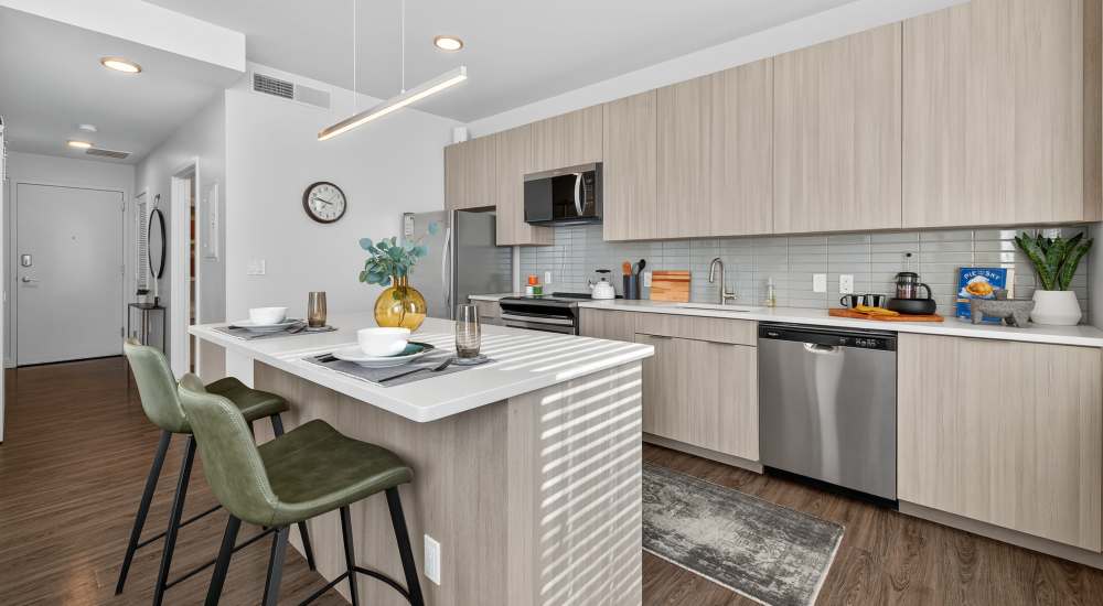 View of the kitchen from the living room at SOVA on Grant in Denver, Colorado 