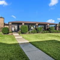 Exterior shot of garden style apartments at Pine Oaks Apartments in Mesquite, Texas