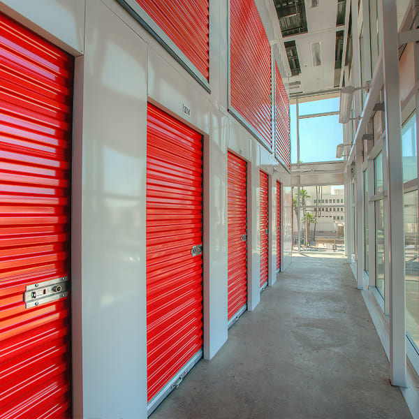 Storage units with red doors at StorQuest Self Storage in Golf, Florida