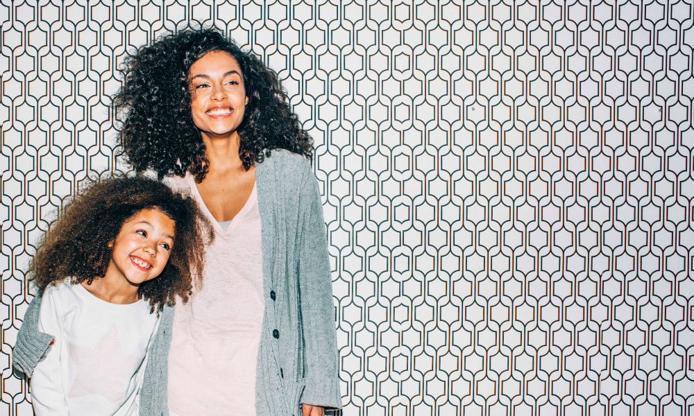 Resident mother and daughter posing for a photo at Sofi Berryessa in San Jose, California