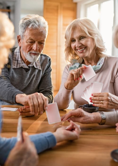 Residents playing cards at The Pillars of Hermantown in Hermantown, Minnesota