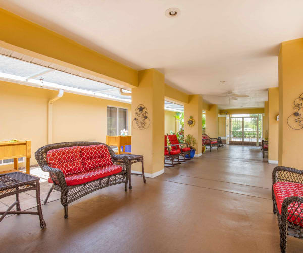 Bright hallway and seating at Sun City Senior Living in Ruskin, Florida