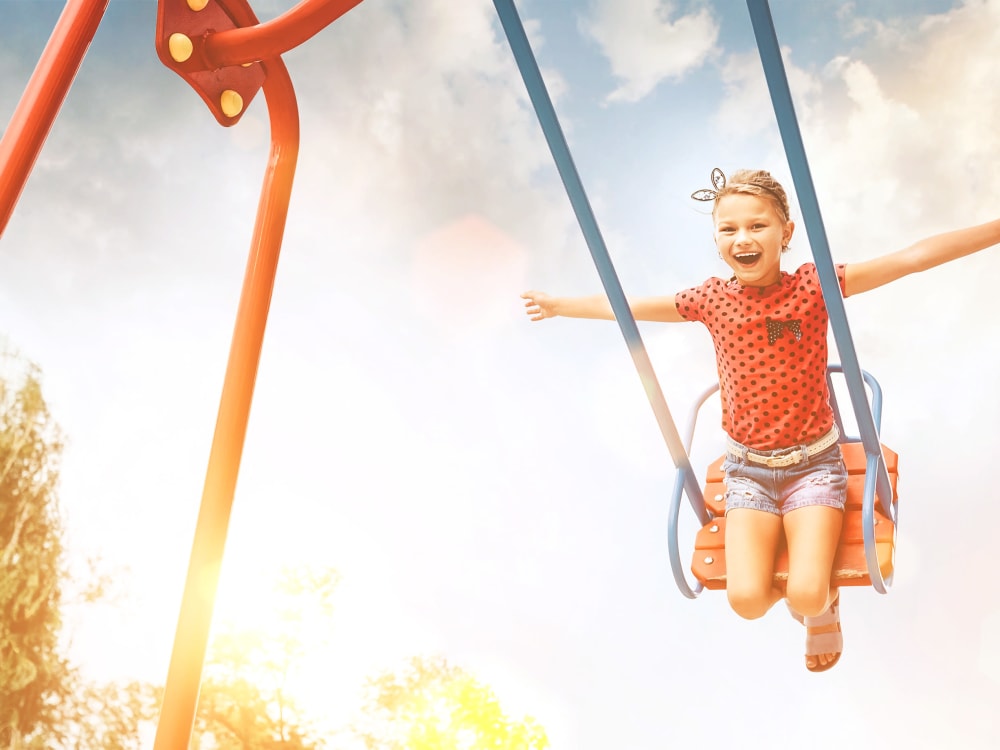 Child on a swing at Sentio in Glendale, Arizona