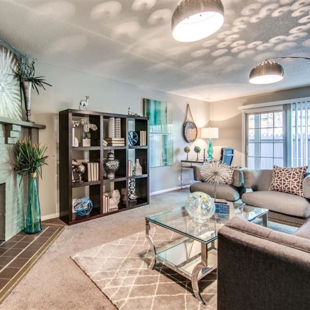 Living room space with sofa and chairs at London House Apartments in Lenexa, Kansas