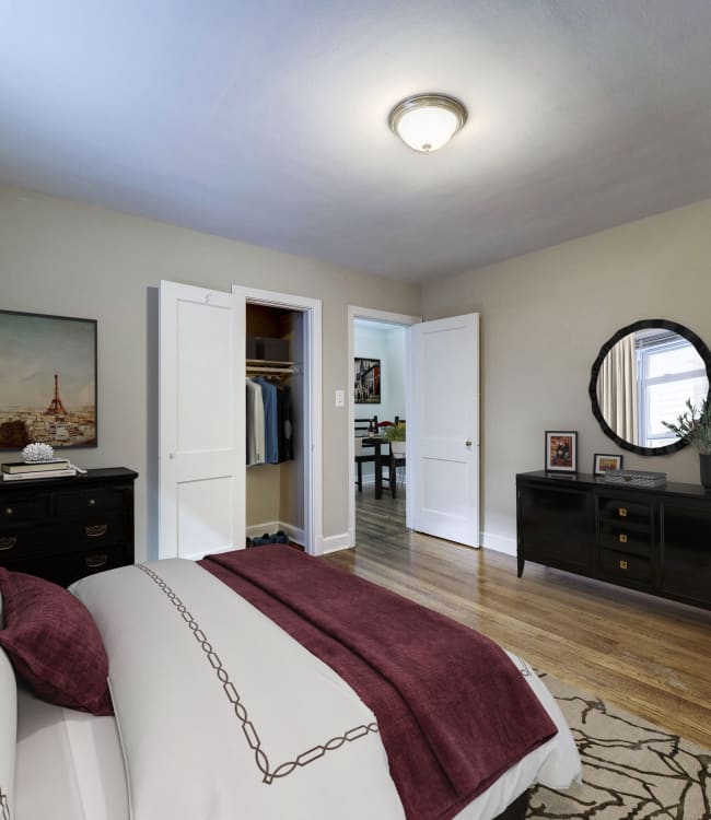 Modern bedroom with closet in a model home at Avondale Apartments in Bethesda, Maryland